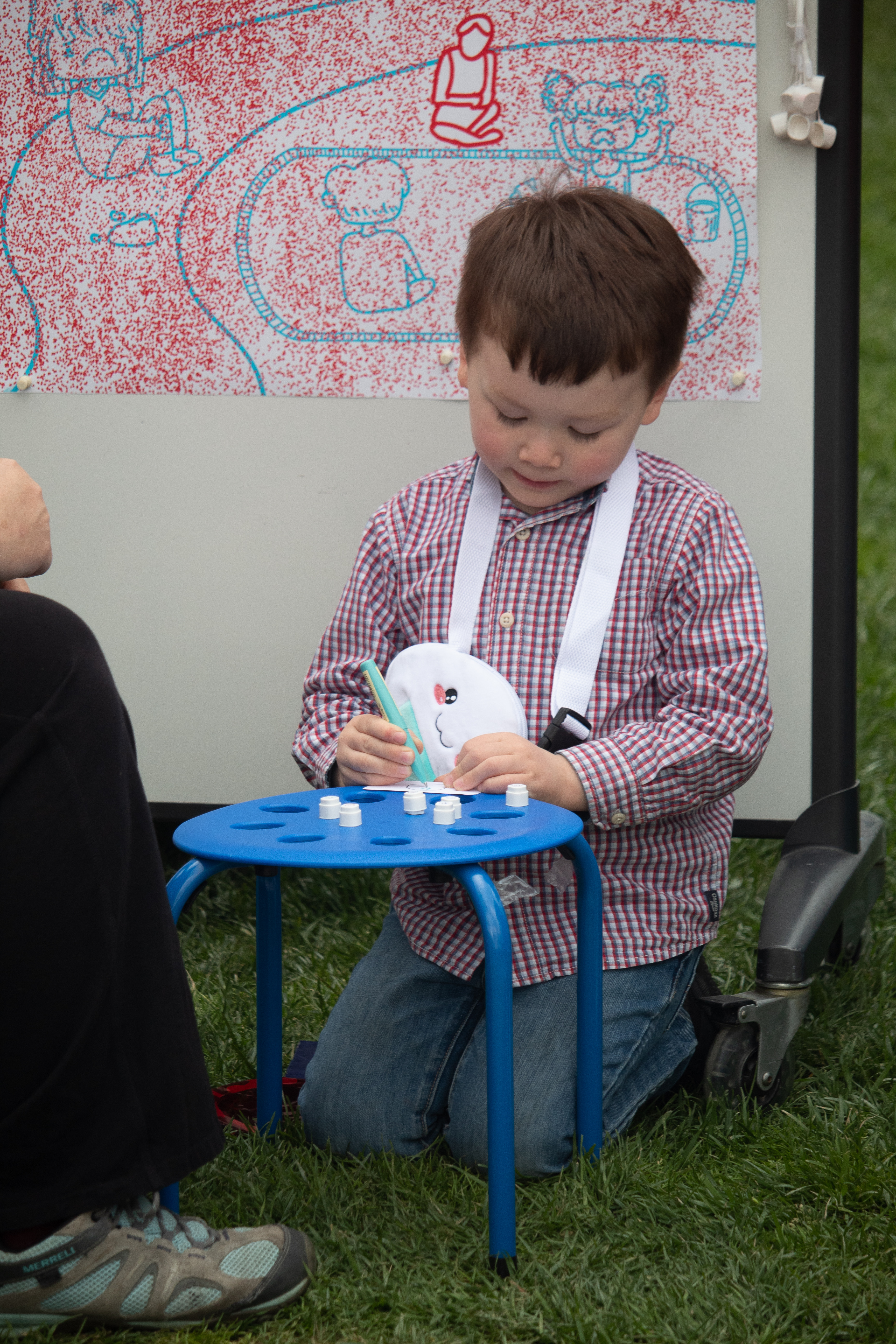 Child doing the take-home drawing activity